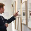 Le prince Harry à la galerie Getty Images à Londres le 25 juillet 2013 lors du vernissage d'une expo photo de Chris Jackson sur le travail de Sentebale. L'occasion de livrer ses premières impressions sur son neveu le prince George de Cambridge.