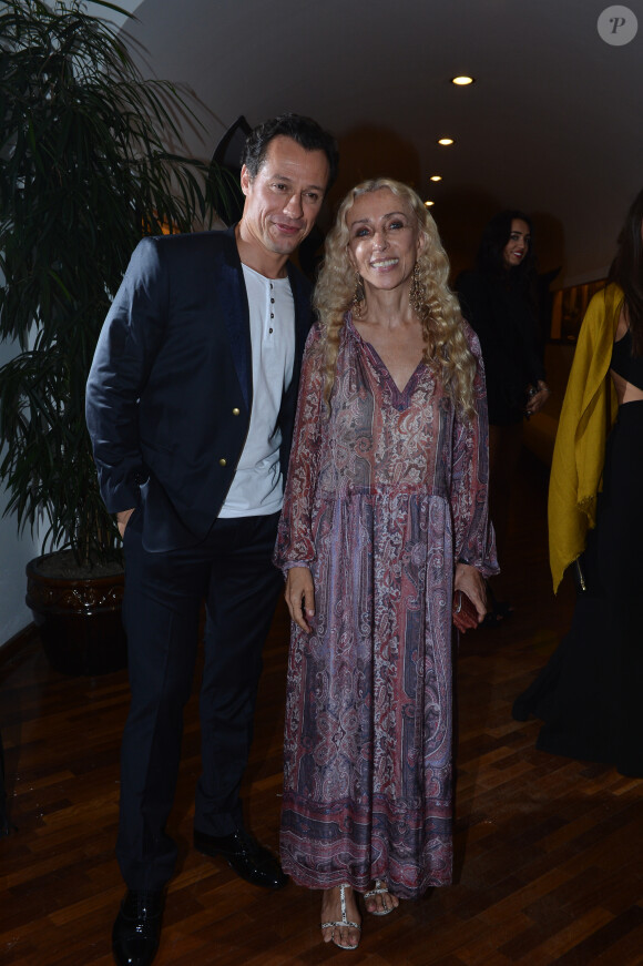 Stefano Accorsi et Franca Sozzani lors du cocktail organisé par L'Uomo Vogue à la Terrazza Maserati, célébrant le début de la 70e Mostra de Venise. Le 27 août 2013.