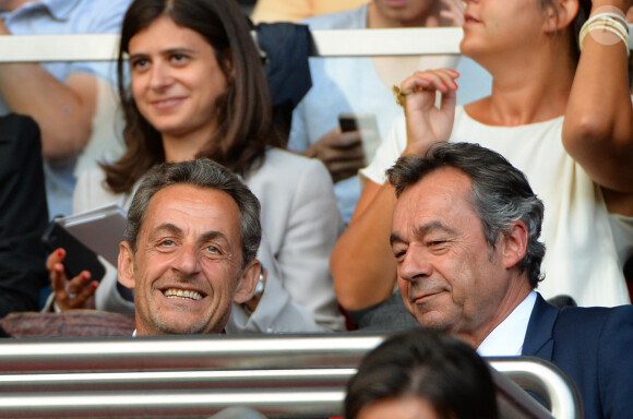 Nicolas Sarkozy et Michel Denisot complices lors de la rencontre de Ligue 1 entre le PSG et Guingamp (2-0), au Parc des Princes, le 31 août 2013.