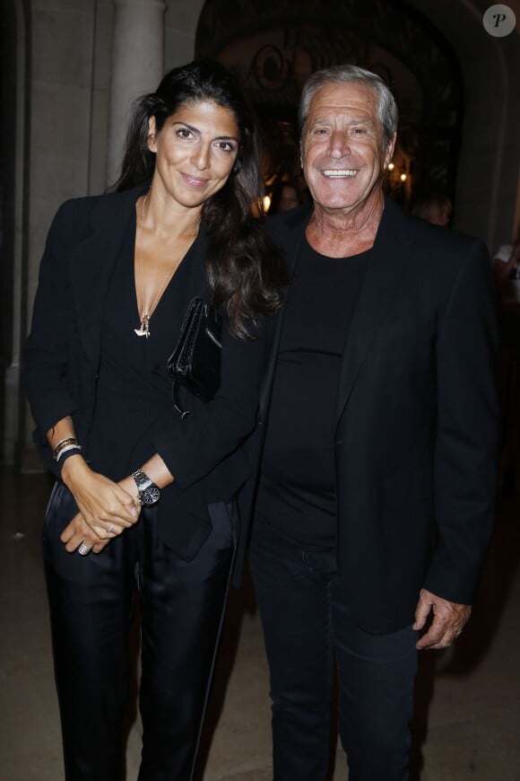 Le milliardaire Jean-Claude Darmon et sa compagne Hoda Roche au lancement de la nouvelle version du magazine "Lui", avenue Foch à Paris, le 3 septembre 2013.