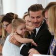 David Beckham et sa fille Harper, assis à côté d'Anna Wintour et Hamish Bowles, assistent au défilé printemps-été 2014 de Victoria Beckham. New York, le 8 septembre 2013.