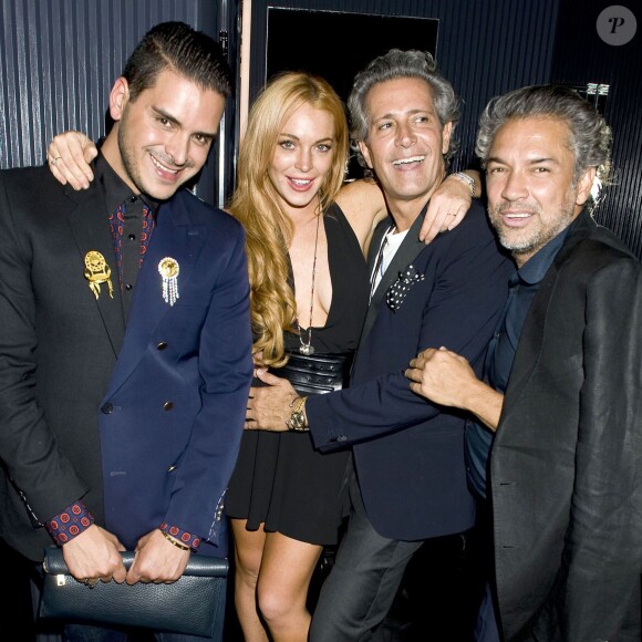 Lindsay Lohan et Markus Molinari entourés d'invités à la soirée de lancement de l'édition septembre 2013 de Purple Magazine à New York, le 11 septembre 2013.