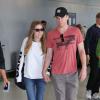 Michael C Hall et sa petite amie Morgan MacGregor quittent l'aéroport de Toronto après le Festival du Film de Toronto, le 11 septembre 2013.