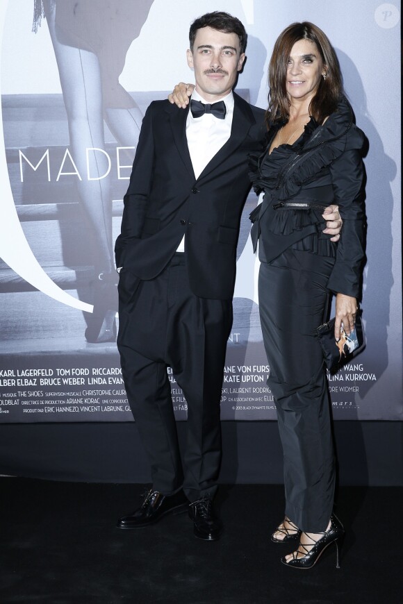 Fabien Constant et Carine Roitfeld assistent à l'avant-première du film Mademoiselle C au Publicis Drugstore. Paris, le 1er octobre 2013.