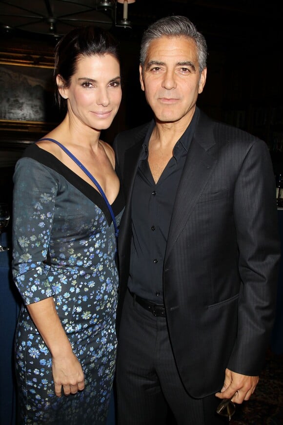 Sandra Bullock et George Clooney lors du déjeuner en l'honneur du le film Gravity à New York le 2 octobre 2013