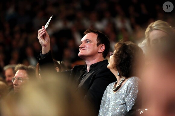 Quentin Tarantino et Claudia Cardinale lors de la soirée d'ouverture du Festival Lumière à Lyon et l'hommage à Jean-Paul Belmondo au sein de la Halle Tony Garnier, le 14 octobre 2013