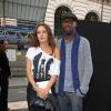 Thomas Ngijol et Karole Rocher lors du plus grand défilé du monde organisé aux Galeries Lafayette le 18 septembre 2012
