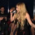 Avril Lavigne fait la fête pour la sortie de son nouvel album à New York, le 5 novembre 2013.