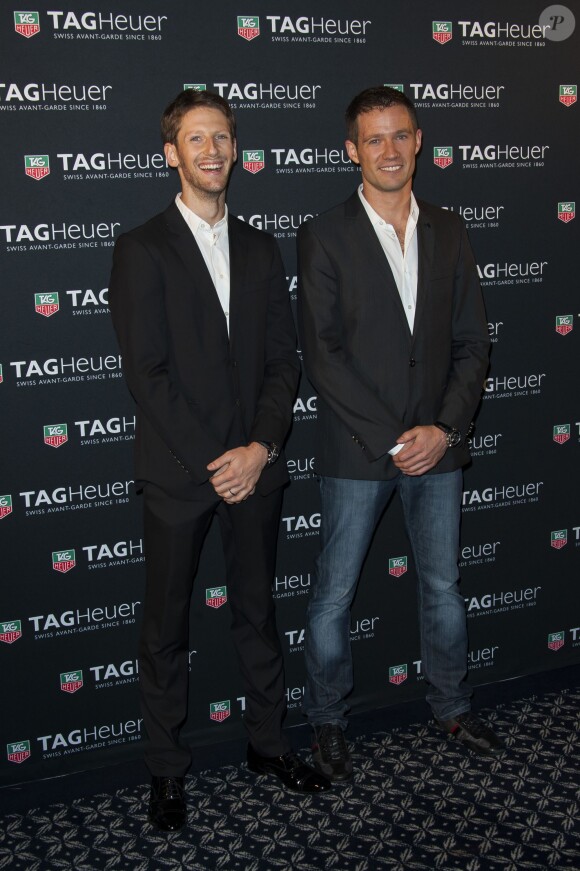 Sébastien Ogier et Romain Grosjean lors de la soirée TAG Heuer qui célébrait le 50e anniversaire de son modèle emblématique, la Carrera, au Pavillon Vendôme à Paris, le 6 novembre 2013