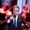 Robbie Williams sur scène lors de la 65e cérémonie des Bambi Awards à Berlin, en Allemagne, le 14 novembre 2013.