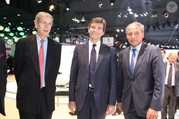 Philippe Varin, Arnaurd de Montebourg et Frédéric Banzet (directeur de Citroën) au salon de l'automobile à Paris le 27 septembre 2012