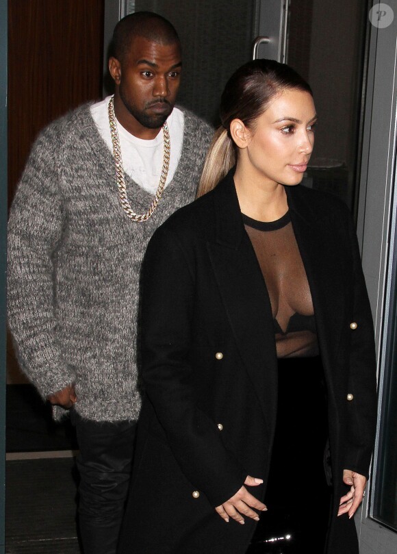 Kanye West et Kim Kardashian se rendent au Barclays Center où le producteur-rappeur s'est donné en concert. New York, le 19 novembre 2013.