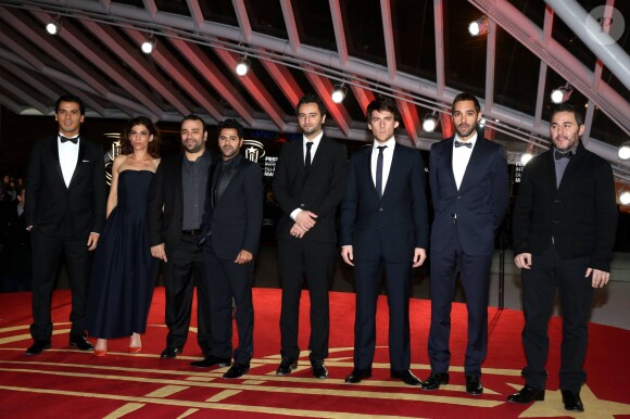 Jamel Debbouze entouré de l'équipe du film "La Marche" au 13e Festival International du Film de Marrakech le 1er décembre 2013.