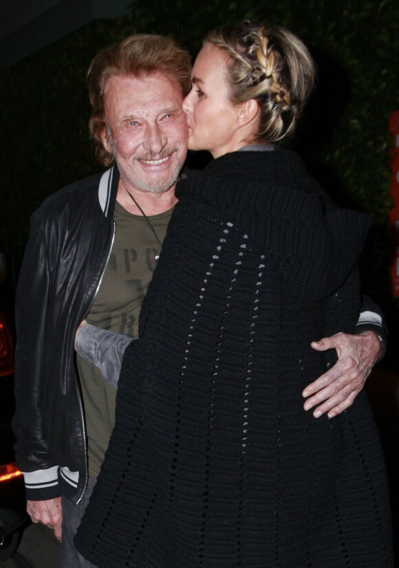 Johnny Hallyday et sa femme Laeticia au restaurent Giorgio Baldi à Los Angeles, le 1er décembre 2013.