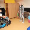 Christophe Jallet visite le service d'aide aux personnes handicapées à la Maison de Marie à Poissy, le 12 décembre 2013 pour la Fondation Paris Saint-Germain.