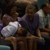 Barack Obama et sa famille assistent à un match de basketball universitaire au Manoa Stan Sheriff Center à Honolulu, le 22 décembre 2013. 