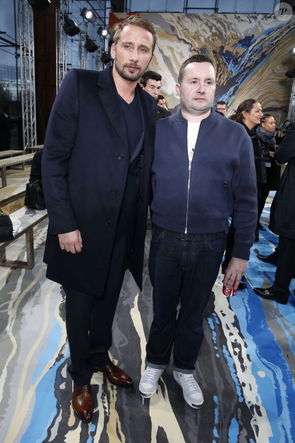 Matthias Schoenaerts et Kim Jones à l'issue du défilé homme Louis Vuitton automne-hiver 2014-2015. Paris, le 16 janvier 2014.