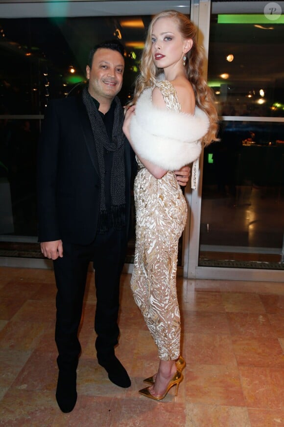 Zuhair Murad et Tanya Dziahileva lors du Dîner de la mode pour le Sidaction au Pavillon d'Armenonville à Paris, le 23 janvier 2014.