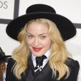 Le sourire en or de Madonna, qui a accessoirisé son smoking d'une paire de grills en or, lors des 56e Grammy Awards au Staples Center. Los Angeles, le 26 janvier 2014.