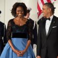Barack Obama et son épouse Michelle lors d'un dîner d'Etat avec François Hollande à la Maison Blanche à Washington, le 11 février 2014