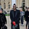 Le footballeur Djibril Cissé arrive au Grand Palais pour assister au défilé Chloé. Paris, le 2 mars 2014.
