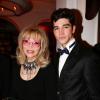 Amanda Lear et Tarik Lakehal lors de l'inauguration du nouveau restaurant de l'Hôtel Vernet à Paris. 20 mars 2014