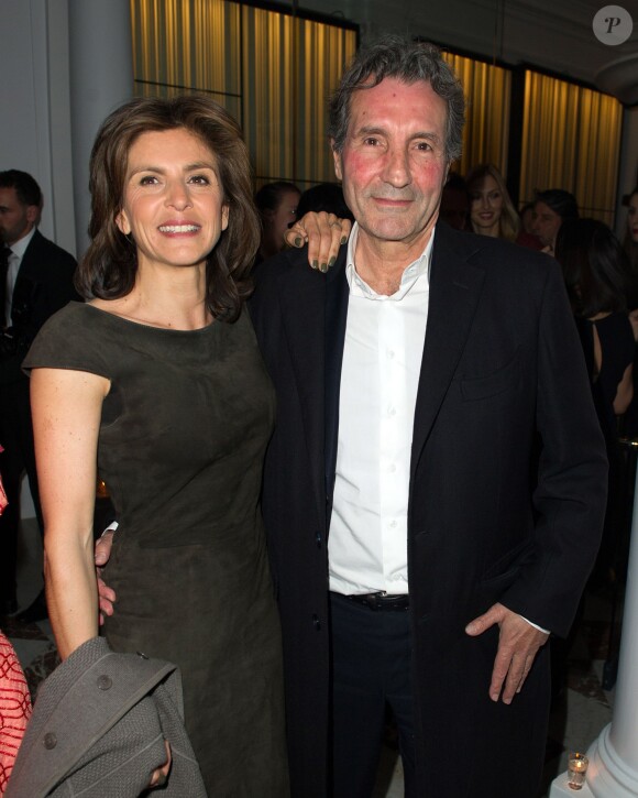 Jean-Jacques Bourdin et Anne Nivat lors de l'inauguration du nouveau restaurant de l'Hôtel Vernet à Paris. 20 mars 2014