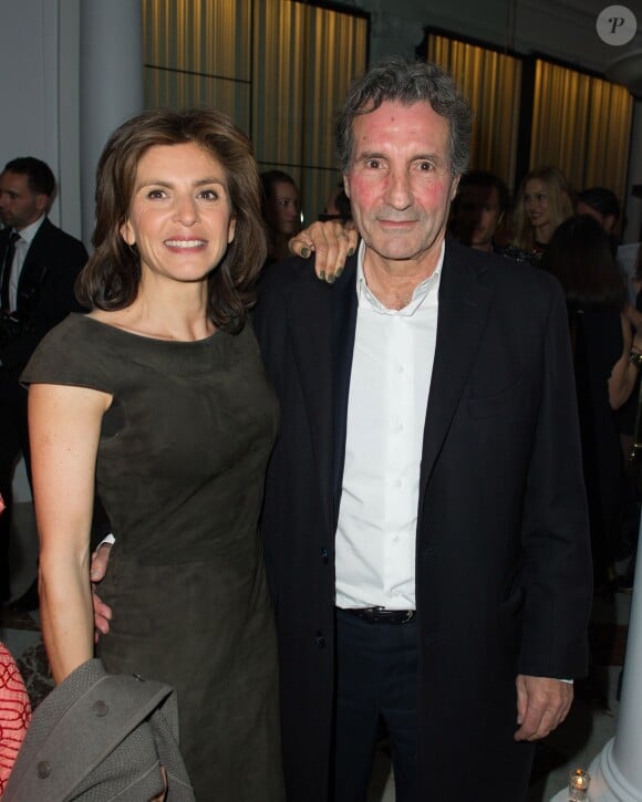 Jean-Jacques Bourdin et Anne Nivat lors de l'inauguration du nouveau restaurant de l'Hôtel Vernet à Paris. 20 mars 2014