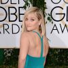 Reese Witherspoon ose la frange sur tapis rouge pour un look glamour