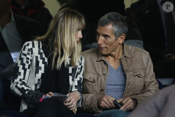 Photo : Nagui et Mélanie Page pendant le match de Ligue des Champions entre le PSG et Chelsea au Parc des Princes à Paris le 2 avril 2014. - Purepeople