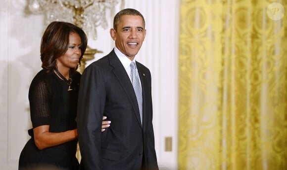 Barack Obama et Michelle Obama lors de la cérémonie donnée en l'honneur des athlètes olympiques de Sochi le 3 avril 2014 à la Maison Blanche à Washington