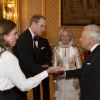Le prince William avec Ralph Lauren et sa femme Ricky, le 13 mai 2014 au château de Windsor, lors d'une soirée de bienfaisance au profit du Royal Marsden Hospital dont le duc de Cambridge est le président et Ralph Lauren le généreux mécène.