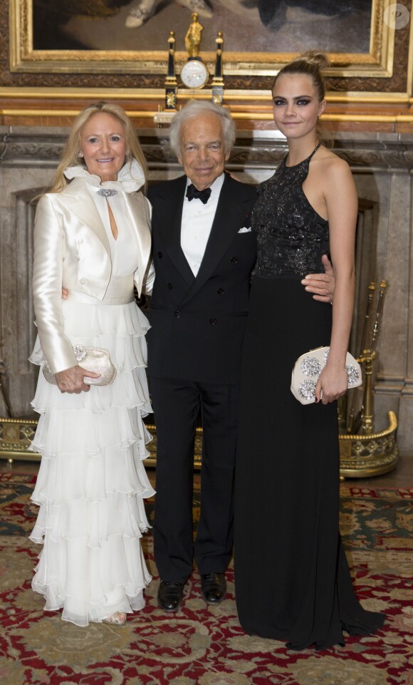 Ralph Lauren et sa femme Ricky avec Cara Delevingne, le 13 mai 2014 au château de Windsor, lors d'une soirée de bienfaisance au profit du Royal Marsden Hospital dont le duc de Cambridge est le président, organisée avec Ralph Lauren.