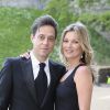 Kate Moss et son mari Jamie Hince posant amoureusement à leur arrivée au château de Windsor, le 13 mai 2014, pour le gala au profit du Royal Marsden Hospital organisé par le prince William et Ralph Lauren.