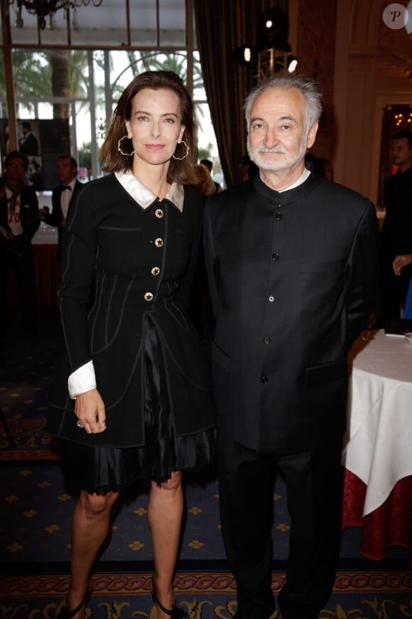 Carole Bouquet et Jacques Attali lors de la 4ème édition du Gala "PlaNet Finance" au Carlton lors du 67ème festival international du film de Cannes le 15 mai 2014