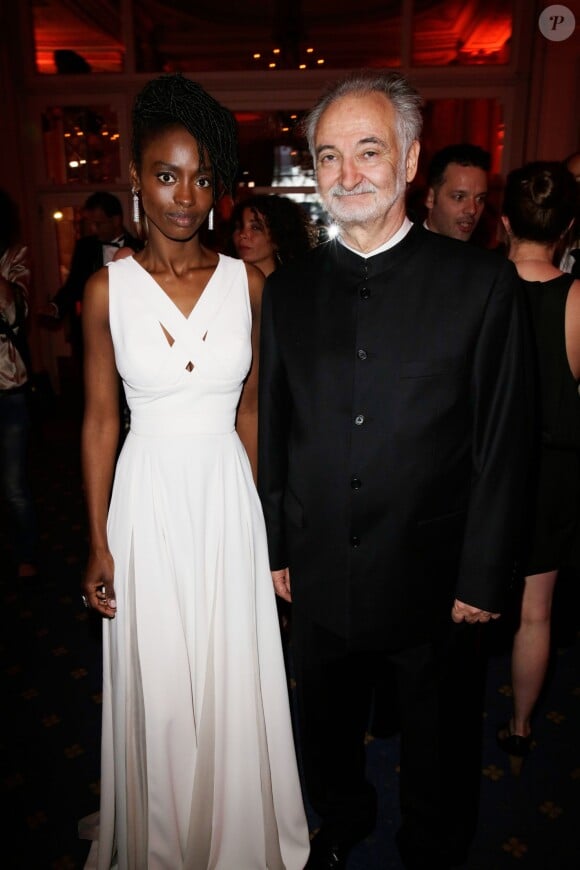 Aïssa Maïga et Jacques Attali lors de la 4ème édition du Gala "PlaNet Finance" au Carlton lors du 67ème festival international du film de Cannes le 15 mai 2014