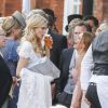 Poppy Delevingne enjoys a glas of beer as she speaks with Geri Halliwell and boyfriend Red Bull F1 boss Christian Horner at a reception in Kensington Gardens for Poppy Delevingne and James Cook's wedding, in London, UK on Friday May 16, 2014. Photo by XPosure/ABACAPRESS.COM17/05/2014 - London