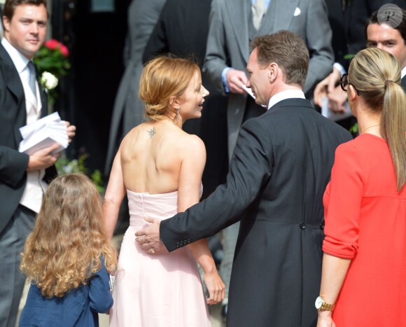 Geri Halliwell et son compagnon Christian Horner lors du mariage de Poppy Delevingne et de James Cook en l'église de "St Paul's" à Londres, le 16 mai 2014.