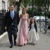 Geri Halliwell avec sa fille Bluebell et son compagnon Christian Horner lors du mariage de Poppy Delevingne et de James Cook en l'église de "St Paul's" à Londres, le 16 mai 2014.