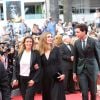 Lisa Azuelos, Julie Gayet et Mika lors de la montée des marches du film Saint Laurent et l'hommage au cinéma d'animation au Festival de Cannes le 17 mai 2014