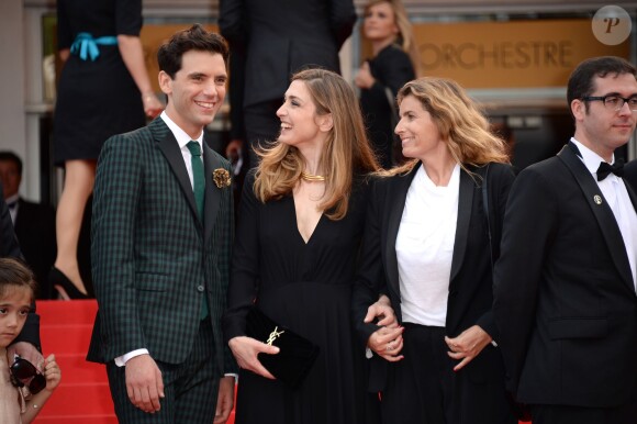 Julie Gayet, Mika et Lisa Azuelos lors de la montée des marches du film Saint Laurent et l'hommage au cinéma d'animation au Festival de Cannes le 17 mai 2014