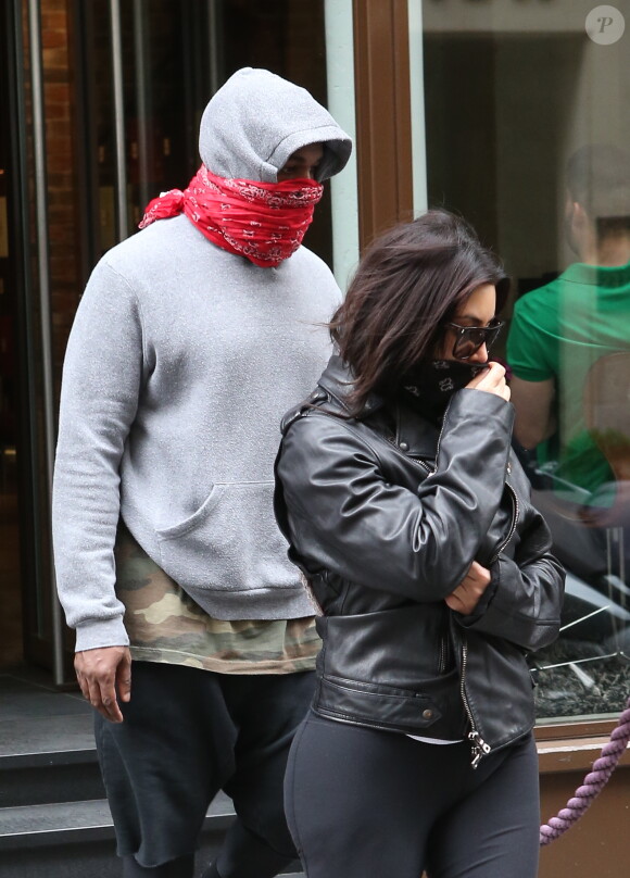 Kim Kardashian et Kanye West devant la salle de gym l'Usine le 20 mai 2014.