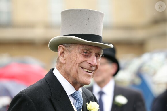 Le prince Philip était de belle humeur lors de la pluvieuse troisième garden party de l'année organisée à Buckingham Palace le 3 juin 2014