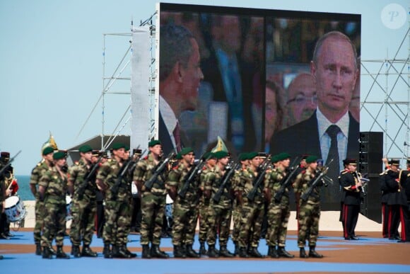 Barack Obama (président américain) et Vladimir Poutine (président russe) - Cérémonie de commémoration du 70e anniversaire du débarquement sur la plage Sword Beach à Ouistreham, le 6 juin 2014.