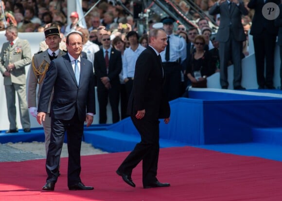 François Hollande (président français) et Vladimir Poutine (président russe) - Cérémonie de commémoration du 70e anniversaire du débarquement sur la plage Sword Beach à Ouistreham, le 6 juin 2014.
