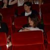 Exclusif - Thomas Ngijol passe devant sa compagne Karole Rocher et leur fille lors de l'avant-première du film "Fastlife" au cinéma Gaumont Marignan dans le cadre du 3e Champs-Elysées Film Festival à Paris, le 11 juin 2014.
