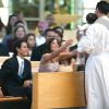 Marc Anthony et Dayanara Torres lors du baptême de leur fils Ryan à Miami. Août 2004.