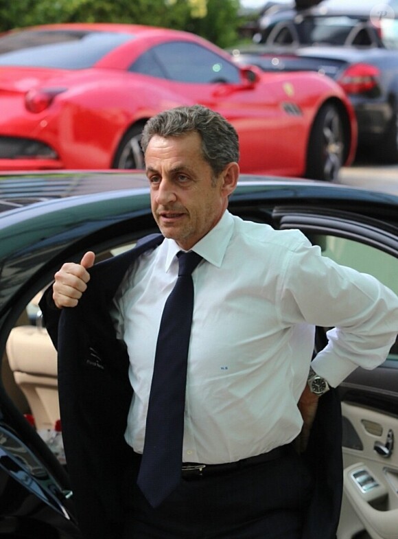 Nicolas Sarkozy arrive à l'hôtel Fairmont Monte-Carlo à Monaco le 18 juin 2014 où il donne une conférence lors du Deloitte World Meet.