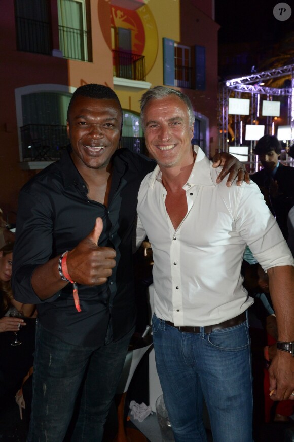 Marcel Dessailly et David Ginola le jeudi 17 juillet 2014, à la soirée annuelle du célèbre Byblos, à Saint-Tropez. 