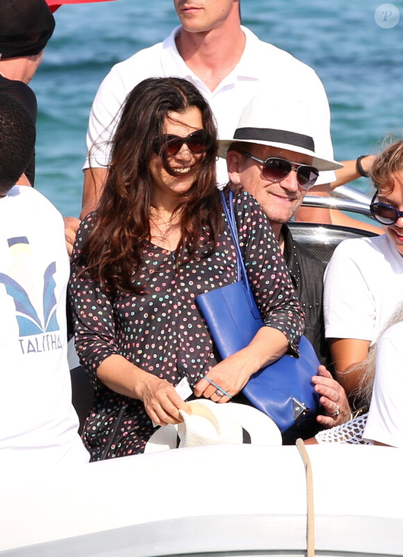 Bono et sa femme Ali Hewson au Club 55 plage de Pampelonne à Ramatuelle, le 24 juillet 2014.
